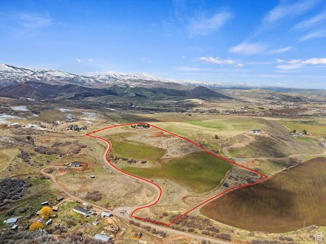 drone / aerial view featuring a mountain view