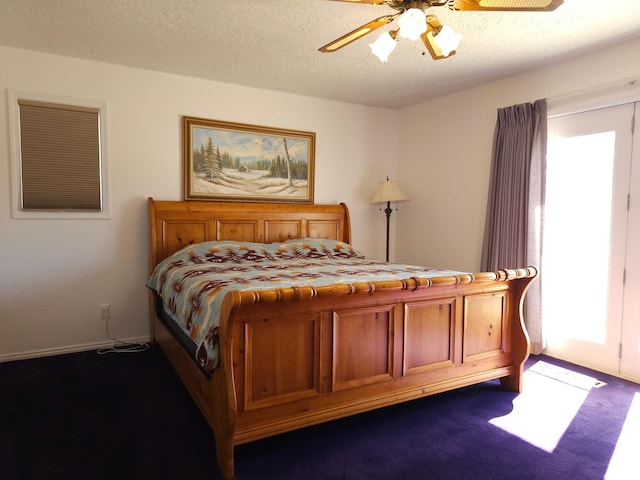 149 Toponce Dr, Evanston, WY 82930 - bedroom featuring a ceiling fan, dark colored carpet, and a textured ceiling