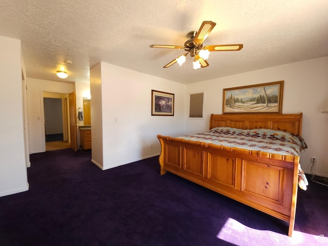 149 Toponce Dr, Evanston, WY 82930 - bedroom with dark carpet, baseboards, ceiling fan, and a textured ceiling