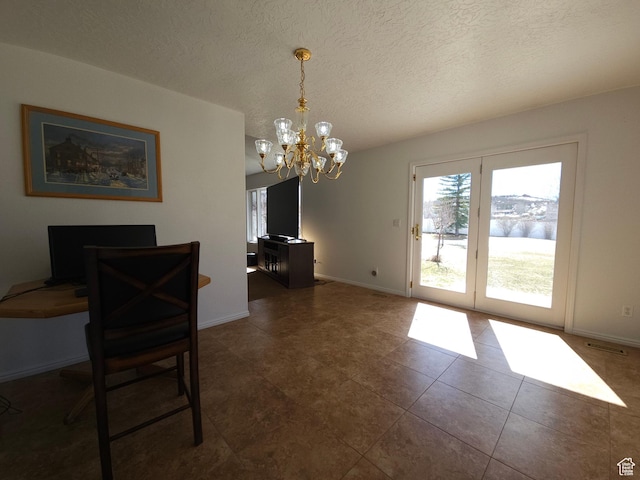 149 Toponce Dr, Evanston, WY 82930 - tiled dining space featuring a chandelier, visible vents, a textured ceiling, and baseboards