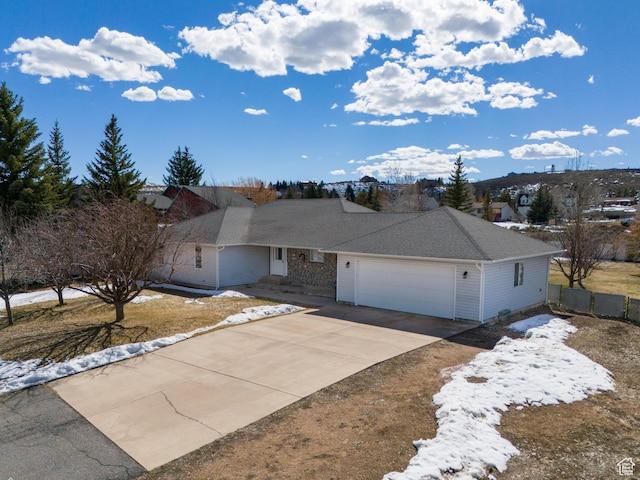 149 Toponce Dr, Evanston, WY 82930 - single story home featuring an attached garage, concrete driveway, and fence