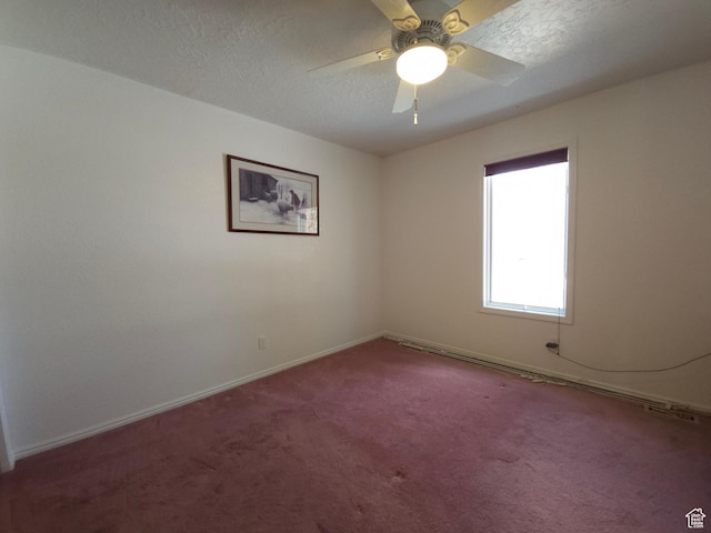 149 Toponce Dr, Evanston, WY 82930 - carpeted spare room with a textured ceiling, baseboards, and a ceiling fan