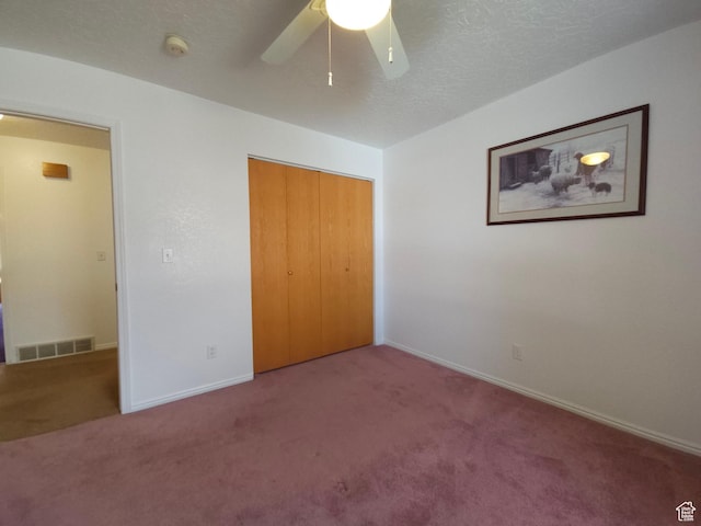 149 Toponce Dr, Evanston, WY 82930 - unfurnished bedroom featuring carpet, a textured ceiling, a closet, visible vents, and baseboards