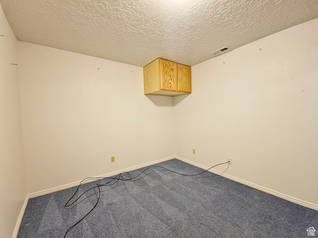 149 Toponce Dr, Evanston, WY 82930 - carpeted spare room with a textured ceiling, baseboards, and visible vents