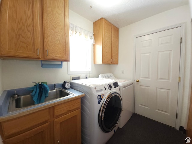 149 Toponce Dr, Evanston, WY 82930 - laundry room featuring washer and clothes dryer, a sink, and cabinet space