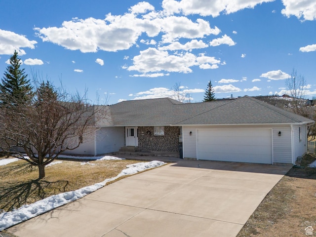 149 Toponce Dr, Evanston, WY 82930 - ranch-style home with a garage, driveway, and a shingled roof