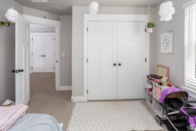 1379 E Hollyhock Ct, Layton, UT 84040 - bedroom featuring baseboards, a closet, and light colored carpet