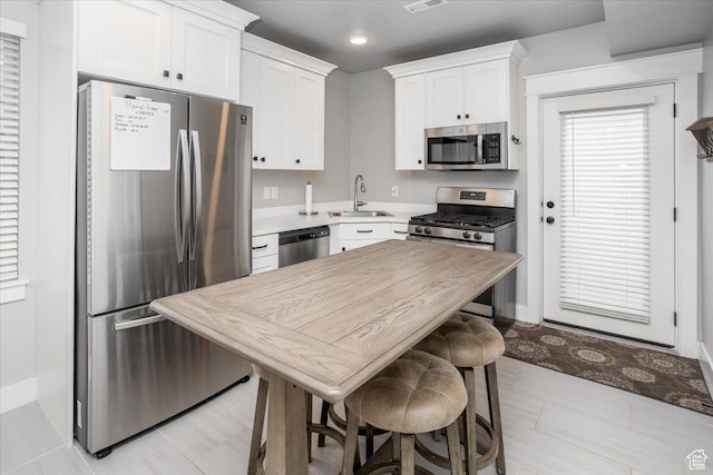 1379 E Hollyhock Ct, Layton, UT 84040 - kitchen featuring appliances with stainless steel finishes, visible vents, a sink, and white cabinets