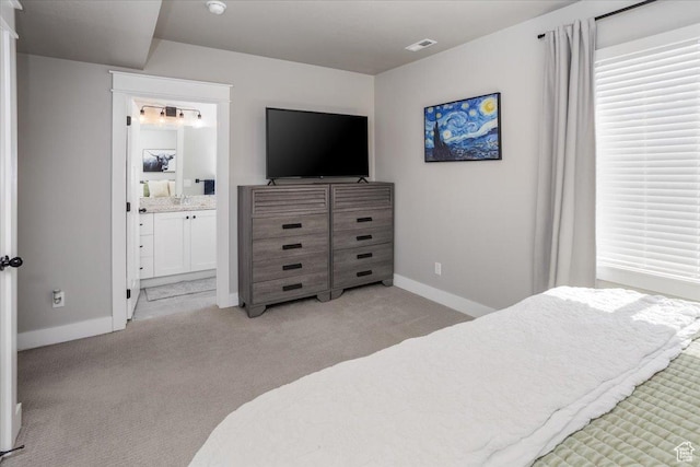 1379 E Hollyhock Ct, Layton, UT 84040 - bedroom featuring light colored carpet, baseboards, ensuite bathroom, and visible vents