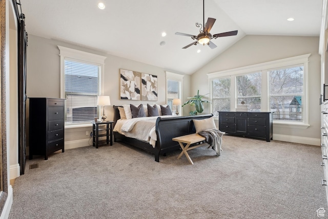 bedroom with lofted ceiling, multiple windows, light carpet, and baseboards