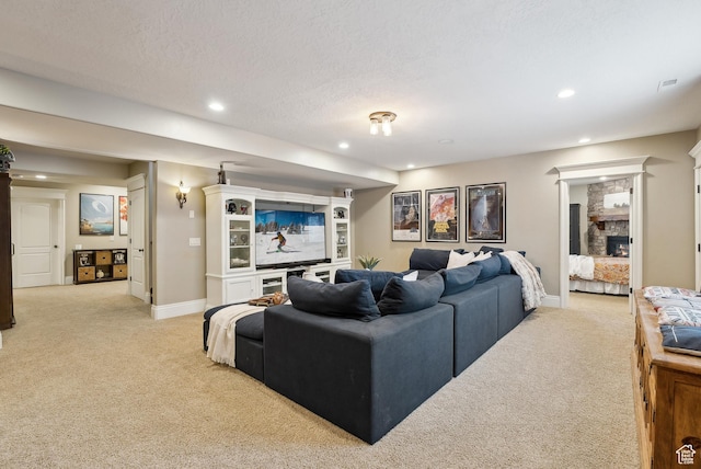 living area with light colored carpet, baseboards, and recessed lighting
