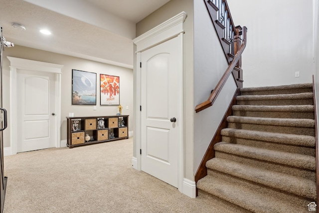 stairway featuring recessed lighting, baseboards, and carpet floors