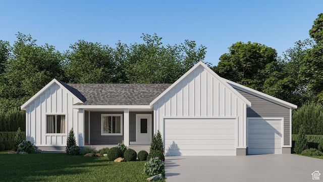 modern inspired farmhouse with board and batten siding, a front yard, an attached garage, and driveway