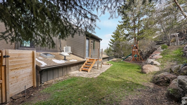 view of yard with central AC and a playground