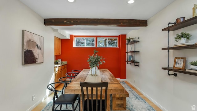 dining area with beam ceiling, baseboards, and recessed lighting