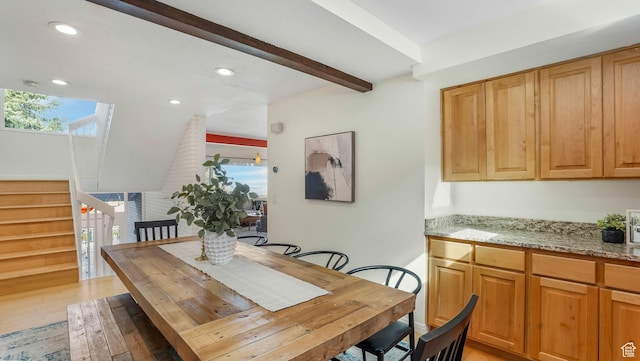 dining space featuring recessed lighting, stairway, light wood-style floors, and beamed ceiling