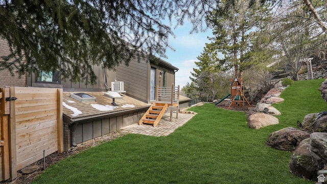view of yard with cooling unit and a playground