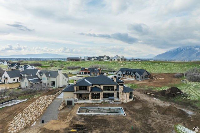 bird's eye view with a residential view and a mountain view