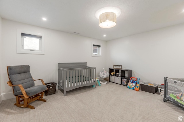 carpeted bedroom with visible vents and recessed lighting