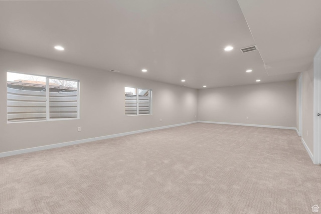 692 W Junegrass Ln, Stansbury Park, UT 84074 - basement with light colored carpet, baseboards, visible vents, and recessed lighting