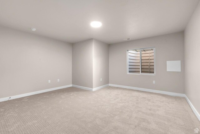 692 W Junegrass Ln, Stansbury Park, UT 84074 - empty room with light carpet and baseboards