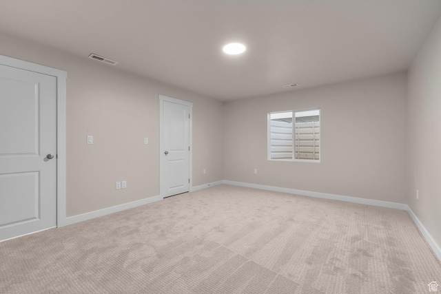 692 W Junegrass Ln, Stansbury Park, UT 84074 - empty room featuring light carpet, visible vents, and baseboards