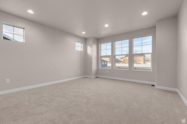 692 W Junegrass Ln, Stansbury Park, UT 84074 - spare room featuring baseboards, recessed lighting, and light carpet