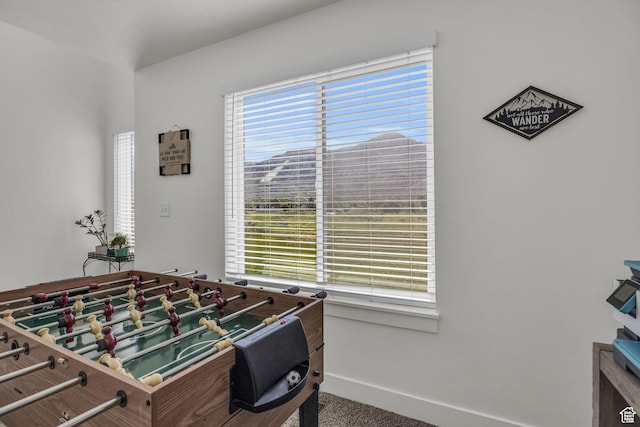 playroom featuring plenty of natural light, carpet, and baseboards