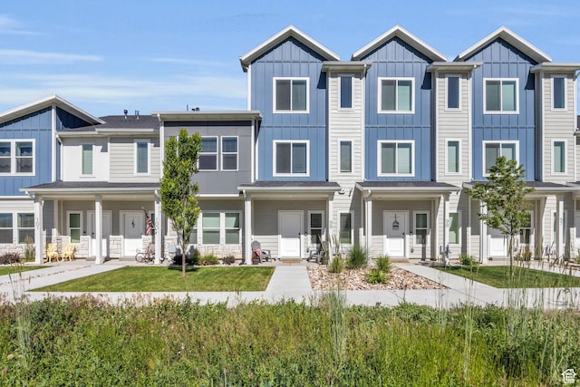 multi unit property featuring a residential view and board and batten siding