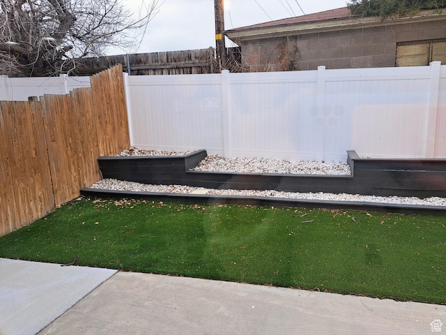 view of yard with a fenced backyard
