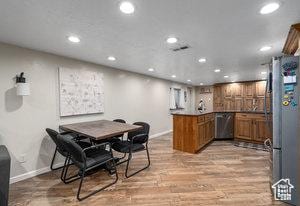 3184 N Timpview Dr N, Provo, UT 84604 - interior space featuring indoor bar, recessed lighting, freestanding refrigerator, and light wood-style floors