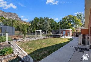 3184 N Timpview Dr N, Provo, UT 84604 - view of yard with a vegetable garden and fence