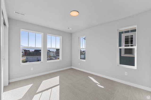 7021 W Granbury Dr, South Jordan, UT 84009 - empty room with carpet flooring, visible vents, and baseboards