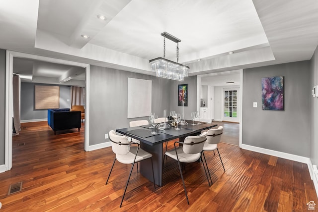 3338 E Creek Rd, Cottonwood Heights, UT 84121 - dining space with a raised ceiling, a chandelier, and dark wood-style floors