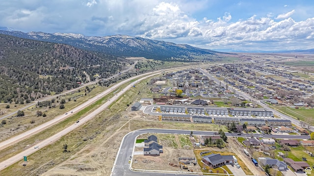 birds eye view of property featuring a mountain view