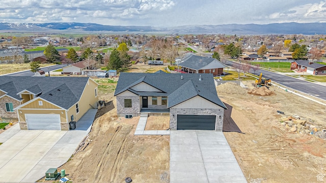 drone / aerial view featuring a mountain view and a residential view