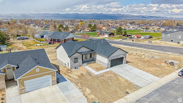 aerial view featuring a mountain view and a residential view