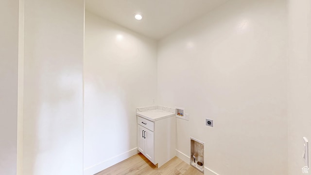laundry area with hookup for a washing machine, electric dryer hookup, light wood-type flooring, recessed lighting, and baseboards