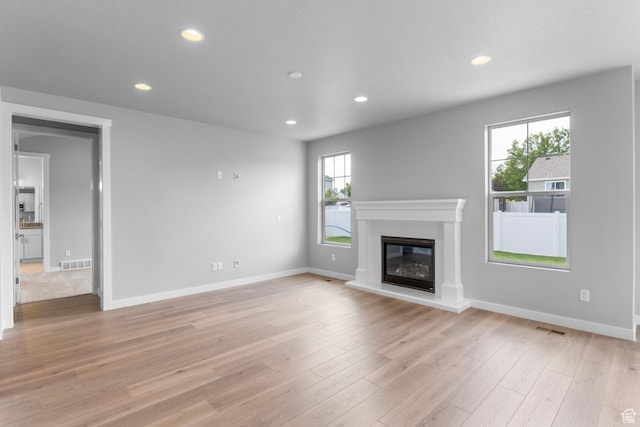 11888 S Golden Pine Ln, Riverton, UT 84065 - unfurnished living room with visible vents, recessed lighting, and light wood-style floors