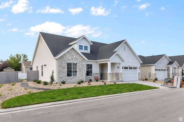 11888 S Golden Pine Ln, Riverton, UT 84065 - view of front facade with roof with shingles, fence, stone siding, and concrete driveway