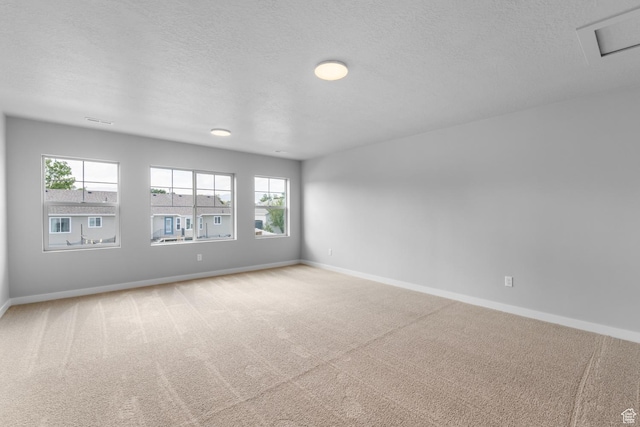 11888 S Golden Pine Ln, Riverton, UT 84065 - empty room featuring carpet, a textured ceiling, and baseboards