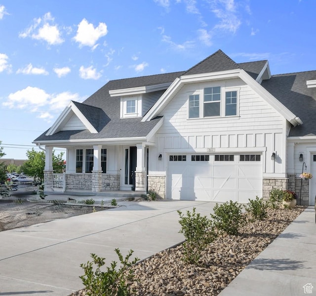 3622 W Harvest Gold Way, Riverton, UT 84065 - view of front of house featuring concrete driveway, a porch, a shingled roof, and stone siding