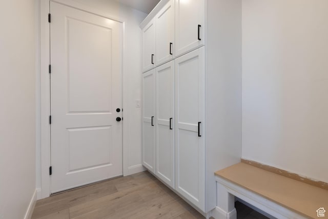 mudroom with baseboards and light wood-type flooring