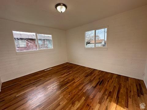 unfurnished room featuring wood finished floors
