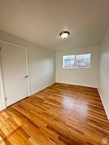 empty room featuring wood finished floors