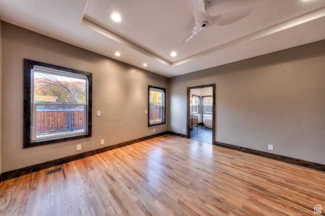 284 W Mcgill Blvd, Moab, UT 84532 - spare room featuring a ceiling fan, visible vents, wood finished floors, a raised ceiling, and baseboards