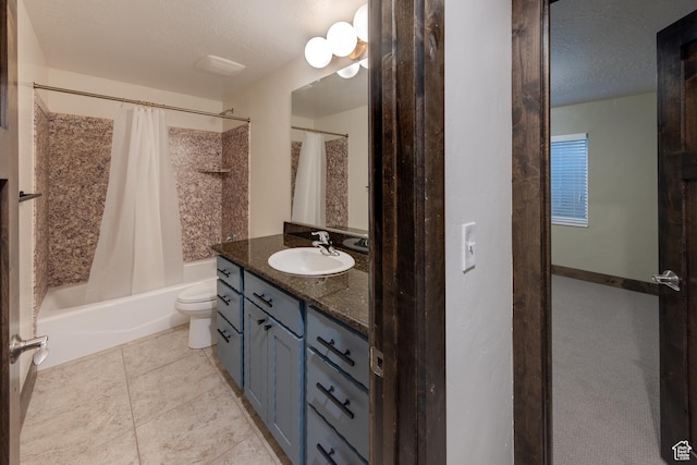 284 W Mcgill Blvd, Moab, UT 84532 - bathroom with vanity, tile patterned floors, a textured ceiling, toilet, and shower / bath combo with shower curtain