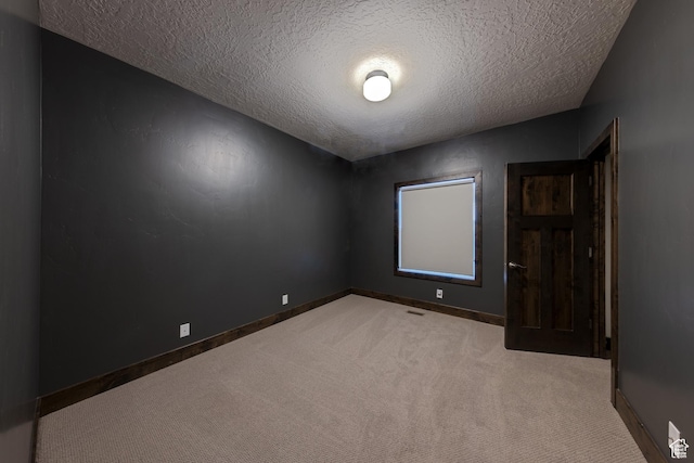284 W Mcgill Blvd, Moab, UT 84532 - carpeted empty room with a textured ceiling, baseboards, and visible vents