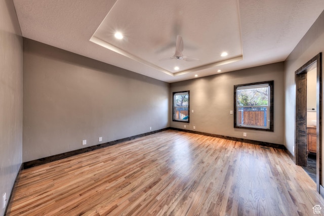 284 W Mcgill Blvd, Moab, UT 84532 - unfurnished room featuring baseboards, recessed lighting, a tray ceiling, ceiling fan, and wood finished floors