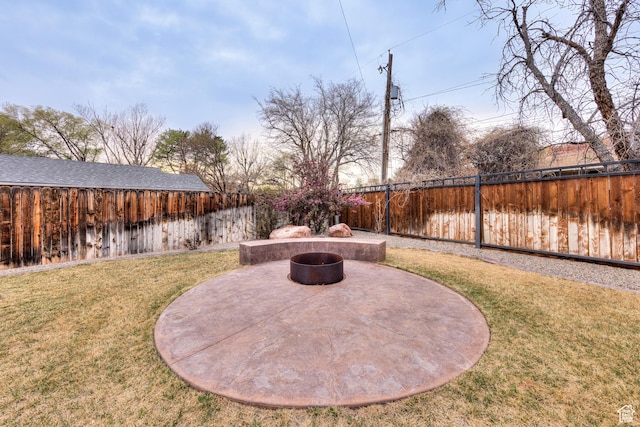284 W Mcgill Blvd, Moab, UT 84532 - view of yard with an outdoor fire pit, a fenced backyard, and a patio